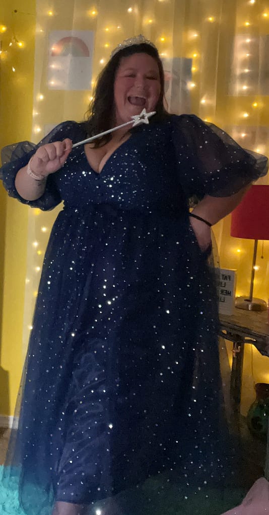 midlife plus size woman in fairy godmother outfit