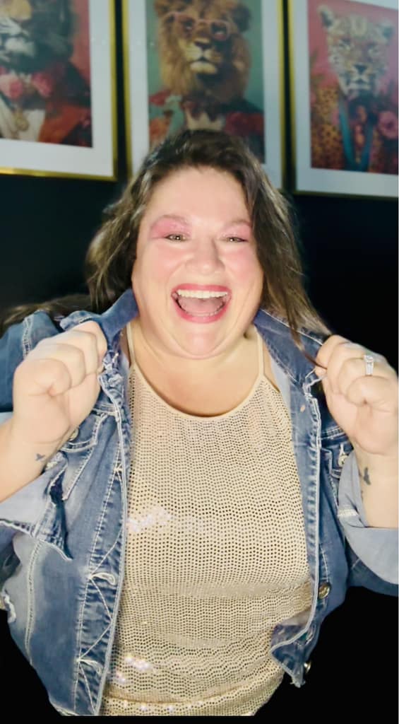 plus size woman jean jacket gold sprakle shirt laughing