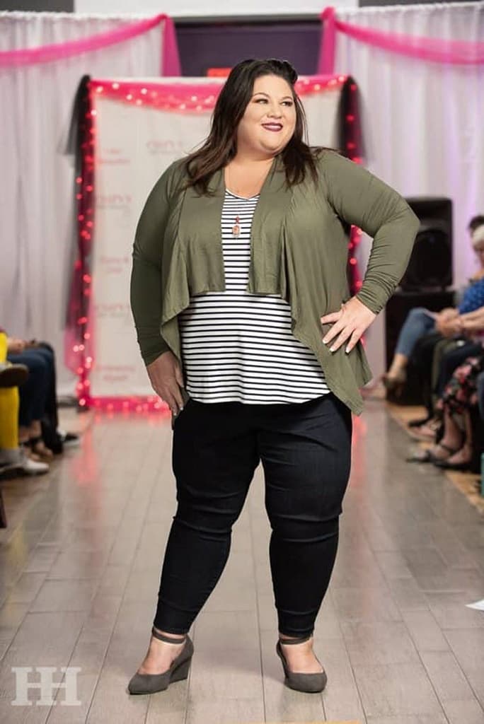 plus size woman - tish lee - in fashion show with green sweater, striped shirt, jeans and heels