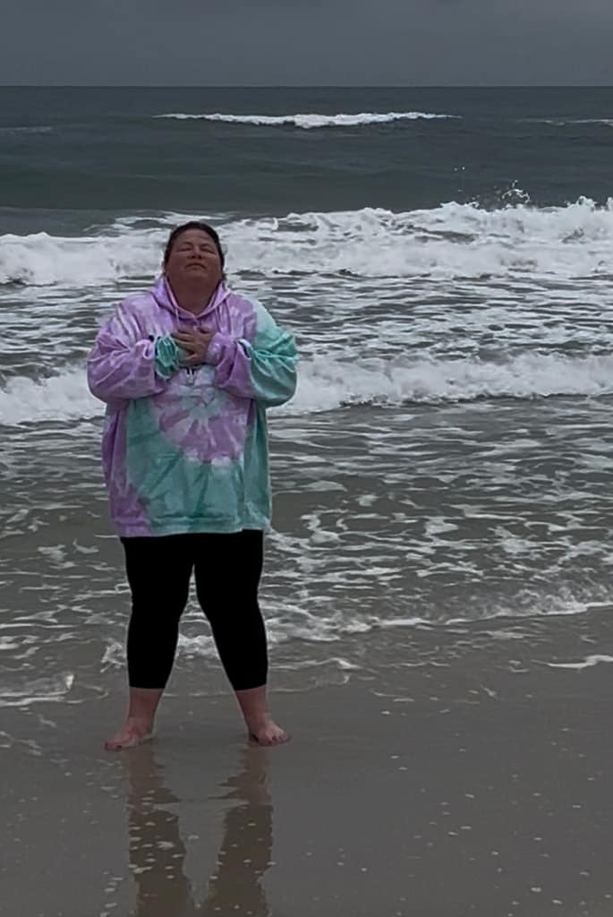 plus size woman standing in gulf shores alabama ocean water