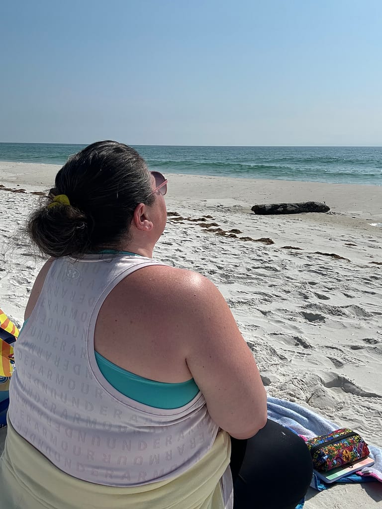 plus size woman sitting on beach in gulf shores alabama